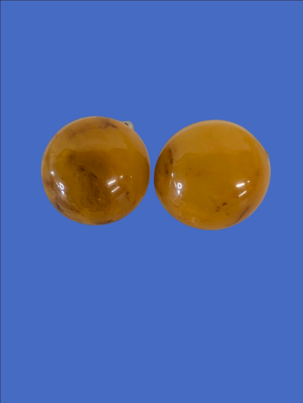 Vintage Bakelite Honey Clip Earrings In Round Button Style.